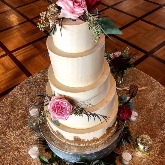 Tiered White Wedding Cake with Roses