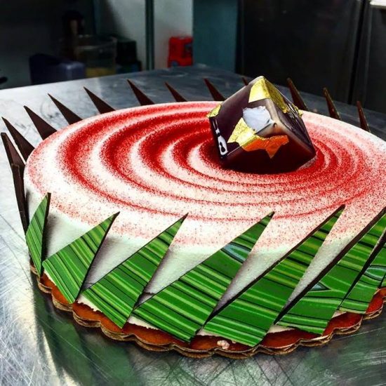 Mousse Cake with Green Chocolate, Red Sprinkles and Gold-Flecked Chocolate