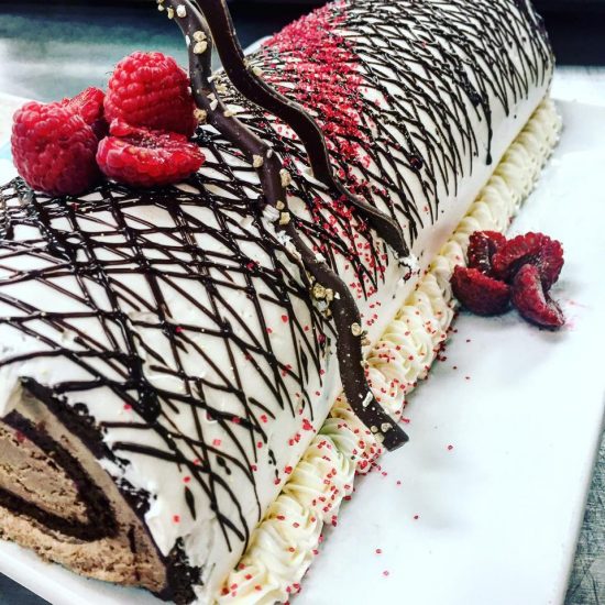 Yule Log with Chocolate, Whipped Cream and Raspberries